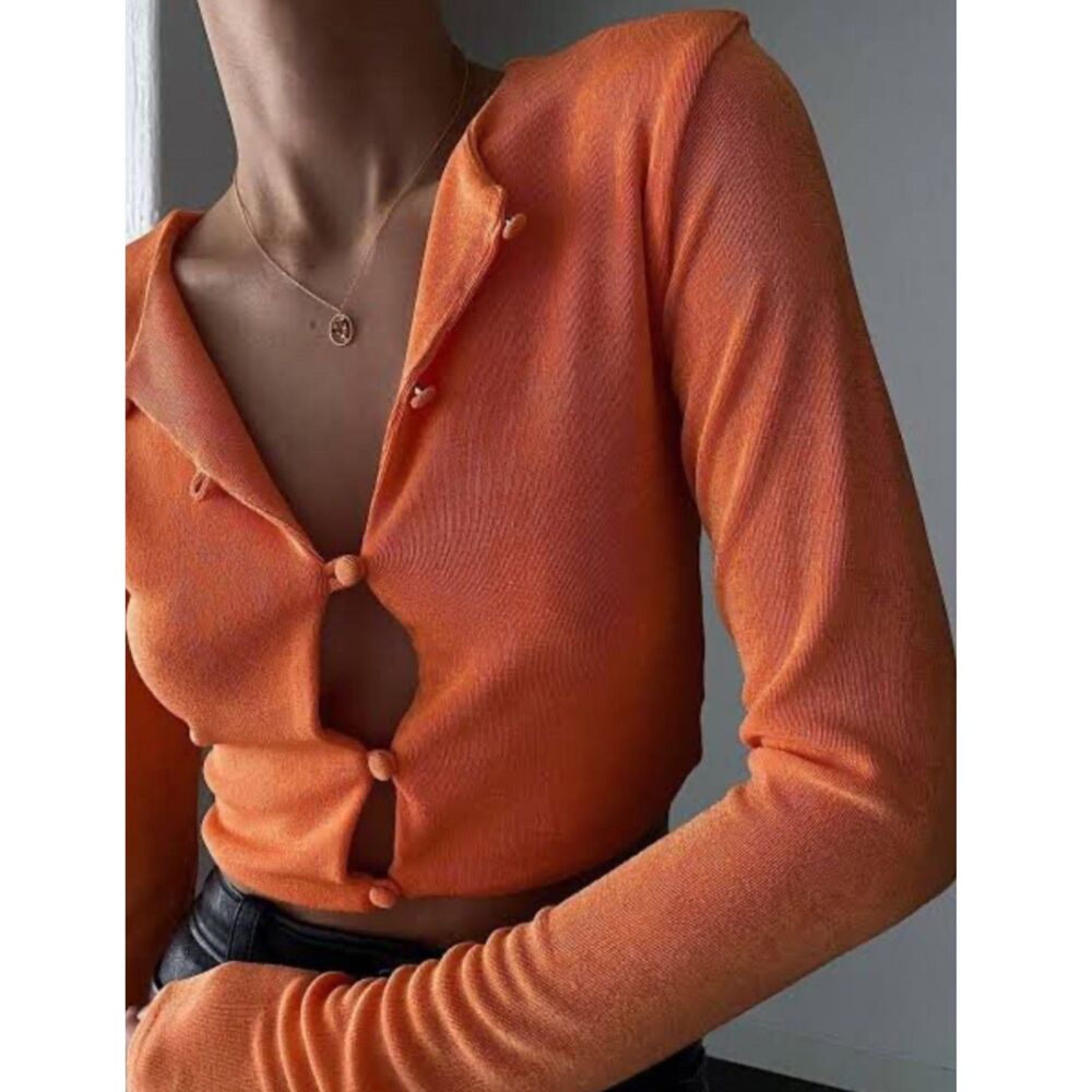 With Jéan Carie Cropped Cardigan in Melon Orange